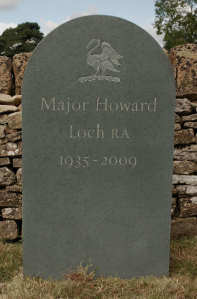 green slate headstone with relief carving